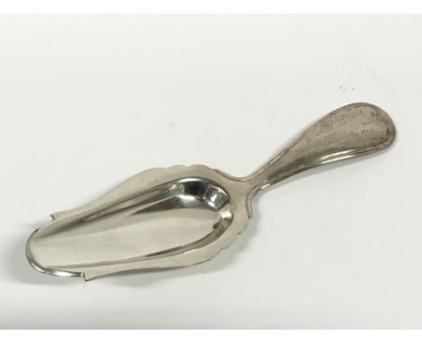 A Dutch silver caddy spoon.