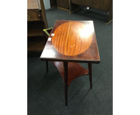 A late 19th century mahogany fold over top card table, mahogany, ebony, holly and satinwood inlaid by Warings, resting on squ