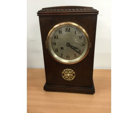 An early 20th century oak cased mantle clock.