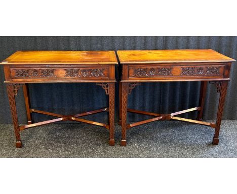 Pair of reproduction mahogany side tables Crossbanded rectangular top, above carved frieze, raised on square section legs wit