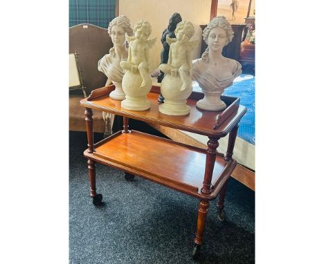 19th Century trolley table, the surface with gallery top above a lower tray raised on turned legs ending in roller feet. [ 73