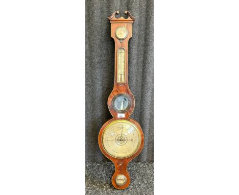 An early 19yth century mahogany cased banjo barometer, silvered indicator dials, central small mirror