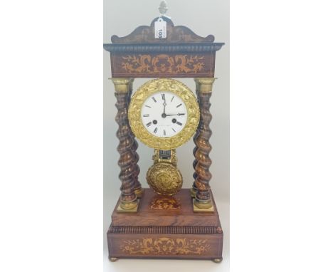 A French Empire portico clock, the inlaid pediment with  rosewood barley twist columns striking 8-day mantel clock, enamel di