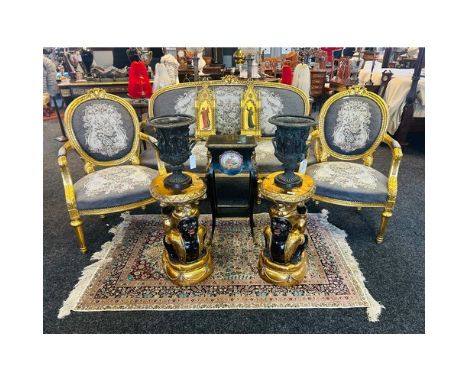 A French giltwood matched three-piece salon suite Comprising a canape, and pair of fauteuils, each with tapestry covering, ca