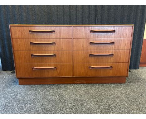 A Mid-Century G-plan double drawer sideboard, The rectangular top above eight drawers [ 72 x 140 x 44.5cm]
