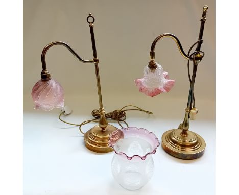 Two Art Nouveau adjustable brass lamps with glass shade[damage to one)