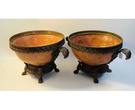 A pair of late 20th century Dresden porcelain bowls decorated with leaves on a pink ground, the whole with bronzed metal moun