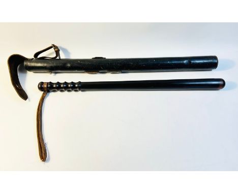 Long ebonised truncheon Ribbed grip and with scabbard