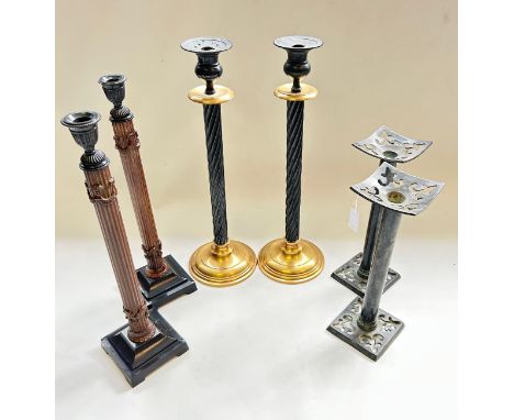 Three pairs of table candlesticksPair of coppered sticks, pierced square drip trays, plain columns and similar pierced basePa