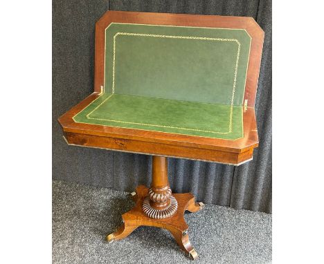 A Victorian mahogany fold over tableCanted rectangular top, plain frieze and raised on plain column support, gadroon ring tur