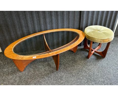 A G-Plan Mid-Century Oval Astro coffee table with a glass top together with a G-Plan Astro dressing Stool, upholstered in a l