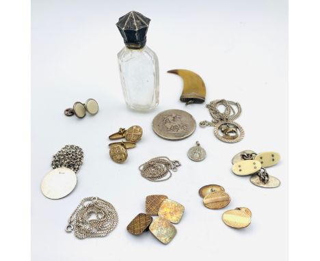 Collection of silver chains and pendants, gold on silver cufflinks, silver crown, perfume bottle and silver topped claw penda