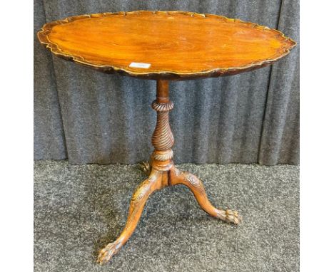 19th century side table, the oval top with pie crust edging raised on a column and a trio of out swept legs ending in hairy p