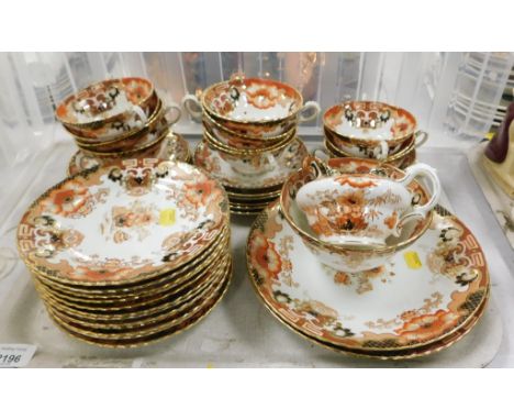 A Wedgwood porcelain part tea service, decorated with orange flowers against a white ground with gilt highlights, to include 