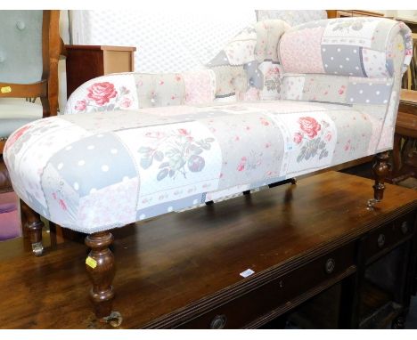 A mahogany chaise longue, upholstered in button back patchwork floral fabric. 