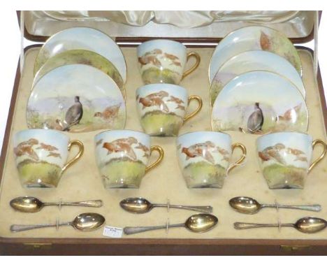 Cased Royal Doulton cups and saucers set decorated with grouse together with six silver spoons