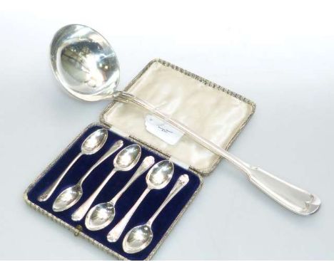 Continental white metal soup ladle and a cased set of six silver golf teaspoons