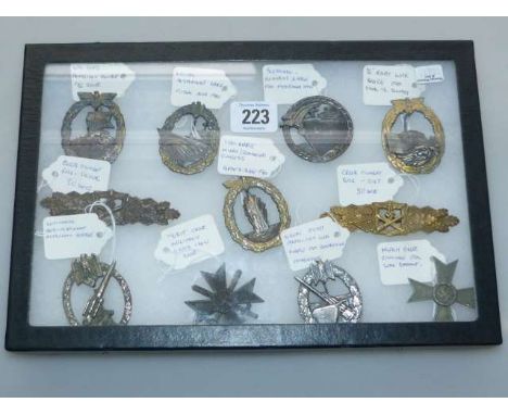 Collection of eleven German badges including Two Close Compact Bars, Blockade Runners, Naval Destroyers, Merit Cross, Naval C