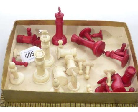 Set of bone and red stained chess pieces
