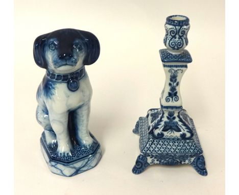 A Makkum porcelain dog group and a similar single candle stick (2)