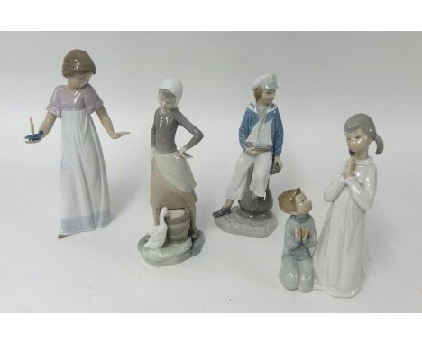 Four Lladro figures.