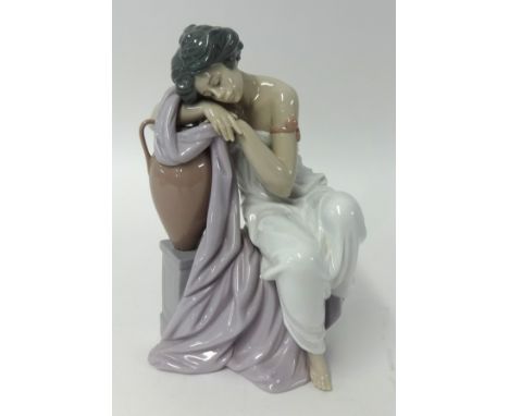 A Lladro figure of a seated lady, height 25cm.