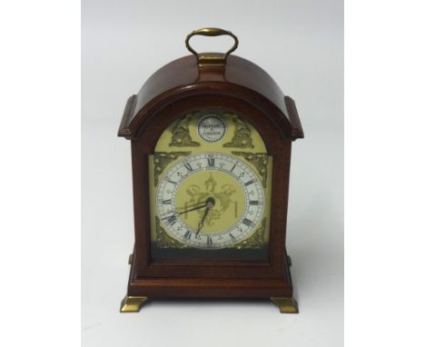 Garrard of London, reproduction mahogany case bracket clock of Georgian design, with key, height 26cm.