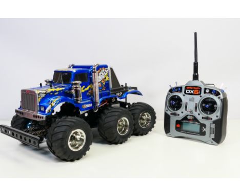 Tamiya - An unboxed kit built Tamiya 1:18 scale radio controlled 'Konghead' 6x6 off road vehicle. The car measures approximat