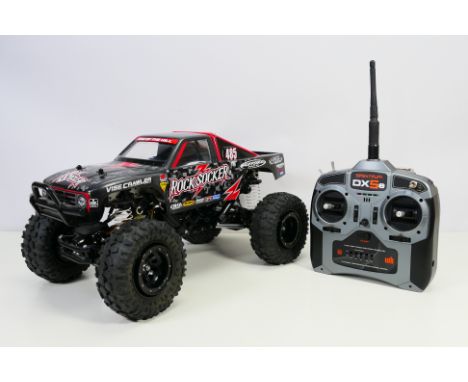 Tamiya - An unboxed kit built Tamiya 1:10 scale radio controlled 'Rock Socker' 4x4 off road car. The car measures approximate
