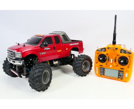 Tamiya - An unboxed kit built attributed to Tamiya 1:10 scale radio controlled Ford F-350 High Lift. The car measures approxi