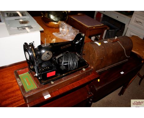 A Singer sewing machine in fitted case - sold as collector's item 