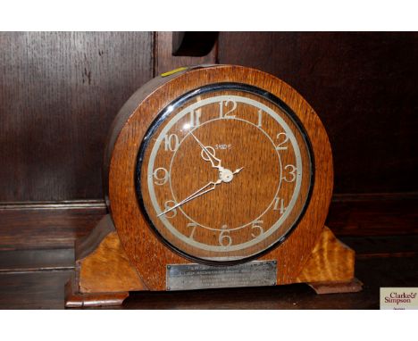 An oak cased Smiths eight day mantel clock
