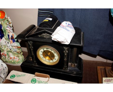 A Victorian black marble mantel clock 