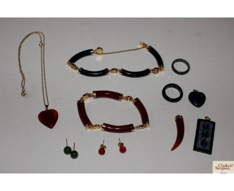 A small jade panel pendant; a heart shaped pendant; a ring; and various other Oriental hardstone jewellery