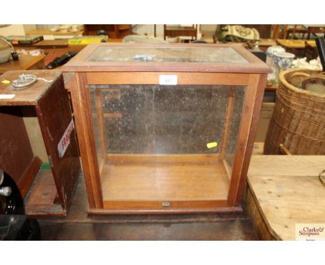 A glazed cabinet for a set of scales (scales missing)