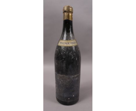 A bottle of 1928 Red Burgundy, believed to be Savigny, shipped by Reid & Kerr, London, excellent vintage slip, faded dark lab