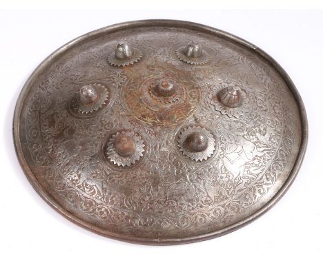 19th Century Indo Persian shield, engraved with arabesque decoration and hunting scenes, seven bosses to the front, leather a