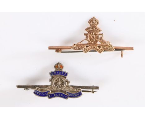 Pre 1952 Royal Artillery badge in yellow metal on a 9ct gold bar with pin fitting, together with a simillar sweetheart badge/