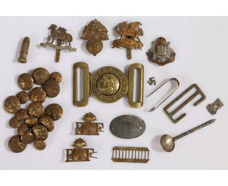 Collection of British army cap badges, shoulder titles and buttons to the Royal Fusiliers, Buffs, Queens Regiment, together w