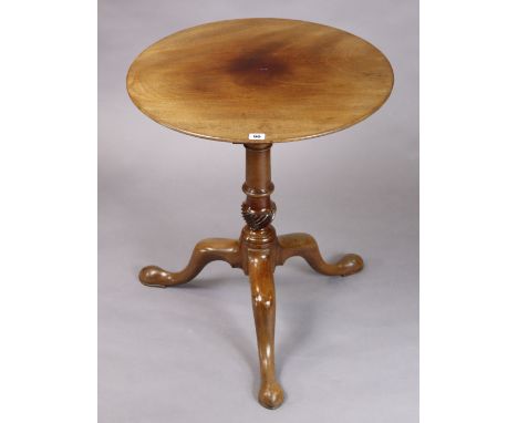 A 19th century mahogany tripod table with a circular top, &amp; on a vase-turned centre column &amp; cabriole legs, 59.25cm d