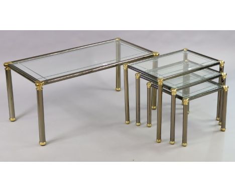 A 1970’s-style silvered-metal low coffee table inset bevelled tampered-glass top, &amp; on four round legs, 102cm wide x 45cm
