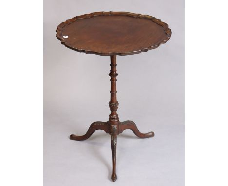 An Edwardan mahogany tripod table in the Chippendale-style, with a moulded pie-crust edge to the circular top, &amp; on a vas