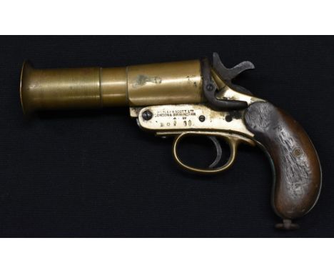 A World War I period Webley and Scott Ltd pistol flare gun, brass body, cast iron spring lock, wooden grip, assorted military