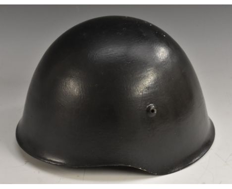 World War Two - a M33 type helmet, the exterior typically painted in black, leather and canvas liner, 1941 - 1945