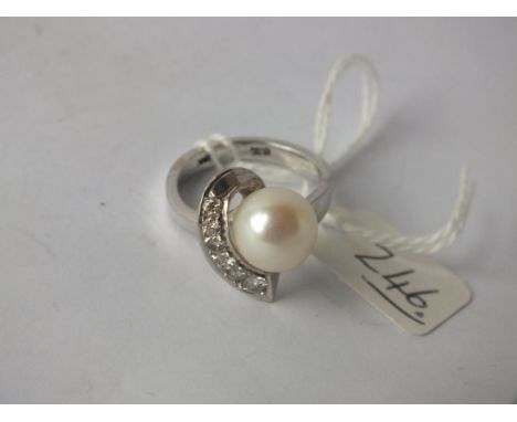 1970’s DIAMOND AND PEARL RING set in 15ct. white gold, size O 8gm