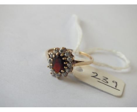 Oval red and white stone dress ring, set in 9ct. size O 2g.    