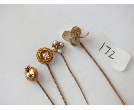 Four various gold stick pins some set with stones      