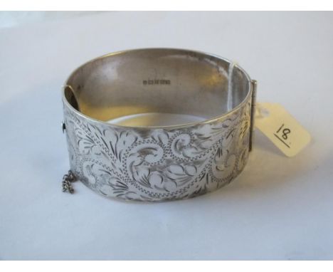 Wide silver hinged bangle engraved with scrolls – 73gm      