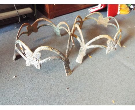 Two rose decorated cast metal planter stands