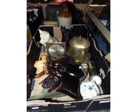 A mixed selection of items to include a pair of spelter Sottish terriers, a brass caddy, mantel clock, wall masks etc